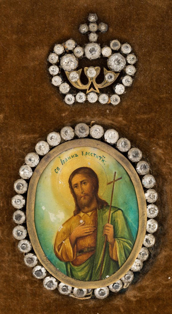 A RUSSIAN ANTIQUE MEDALLION ICON OF SAINT JOHN THE: A RUSSIAN ANTIQUE MEDALLION ICON OF SAINT JOHN THE BAPTIST WITH GLASS GEMS , the oval medallion of Saint John the Baptist on a mother of pearl ground, surrounded by a wreath of cut glass gems and a cu
