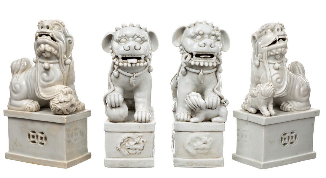 A GROUP FEATURING TWO PAIRS OF BLANC-DE-CHINE LIONS (1 of 4)