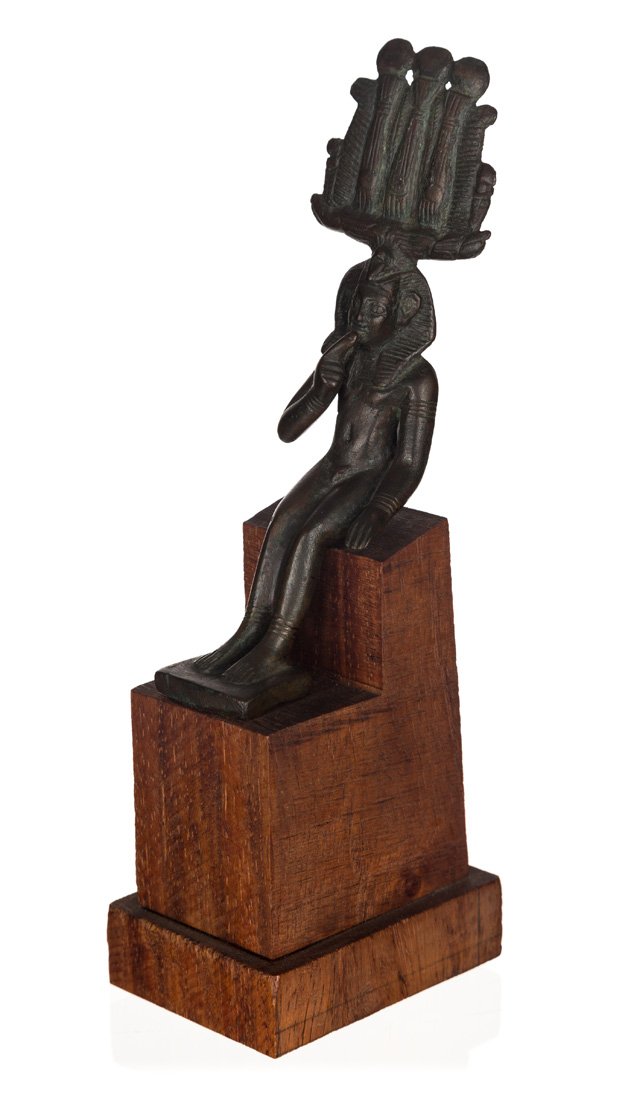 AN ANCIENT BRONZE EGYPTIAN STATUE OF A SEATED BOY (1 of 3)