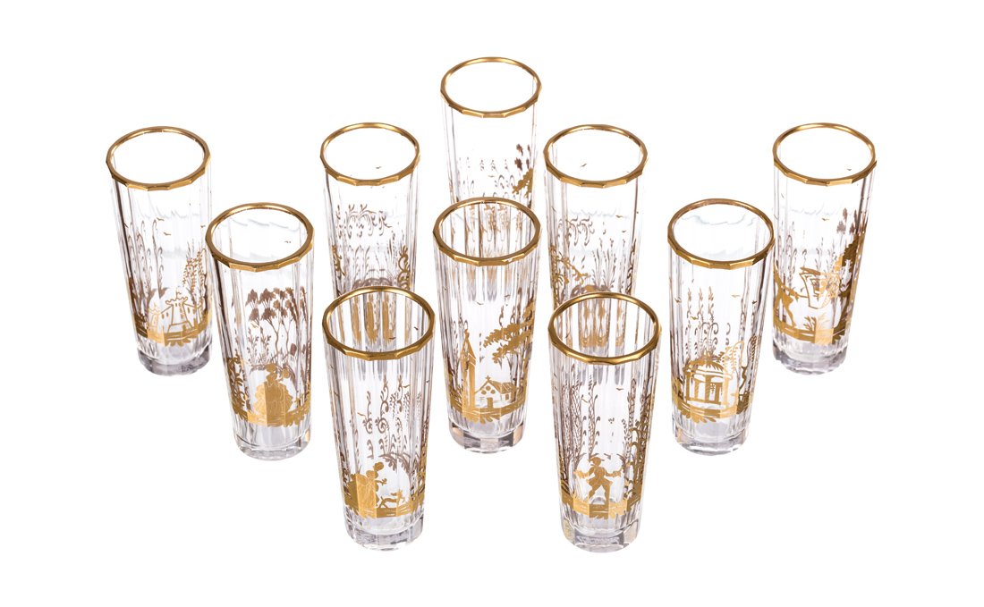 A SET OF TEN CORDIAL GLASSES, AFTER POTEMKIN GLASS: A SET OF TEN CORDIAL GLASSES, AFTER POTEMKIN GLASS FACTORY based on the original 18th century design by the Potemkin Glass Factory, the faceted sides of each beaker are ornamented with gilded decorati