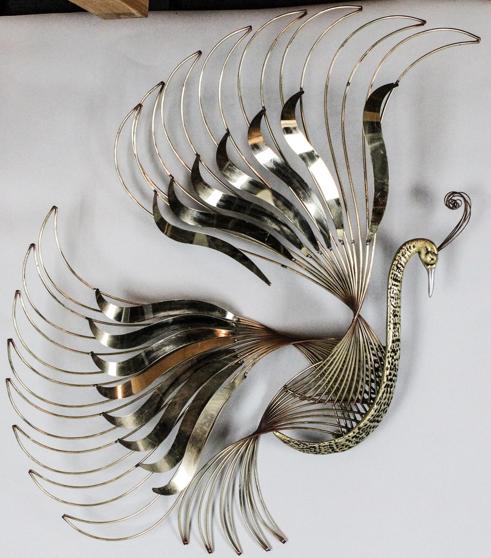 C Jere 1988 Metal Phoenix Wall Sculpture: C Jere 1988 Metal Phoenix Wall Sculpture Size: H45 x W31 x D1 in. Metal 1988 Wt: 14 lbs. This sculpture comes from the French metalwork design company, Curtis Jere. Two wings are loose from one end. O