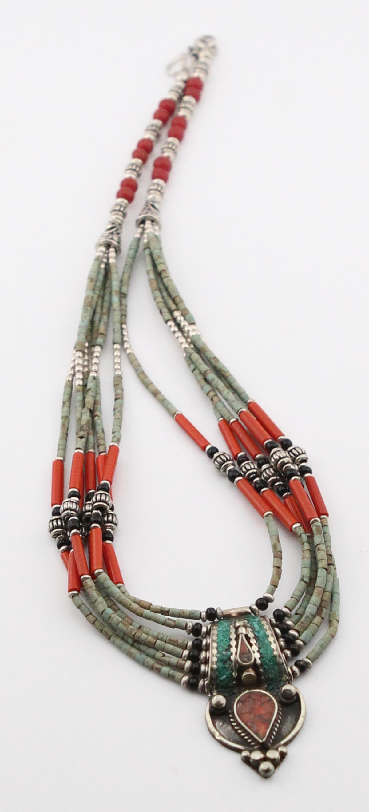 Handmade 925 Sterling Silver Tibetan Necklace: Handmade 925 Sterling Silver Tibetan Necklace Size: 10 in. long. 925 Sterling Silver, orange copper turquoise, jasper,malachite, onyx, and coral. Wt: 38.3 gr. A Handmade 925 Sterling Silver Tibetan Ne