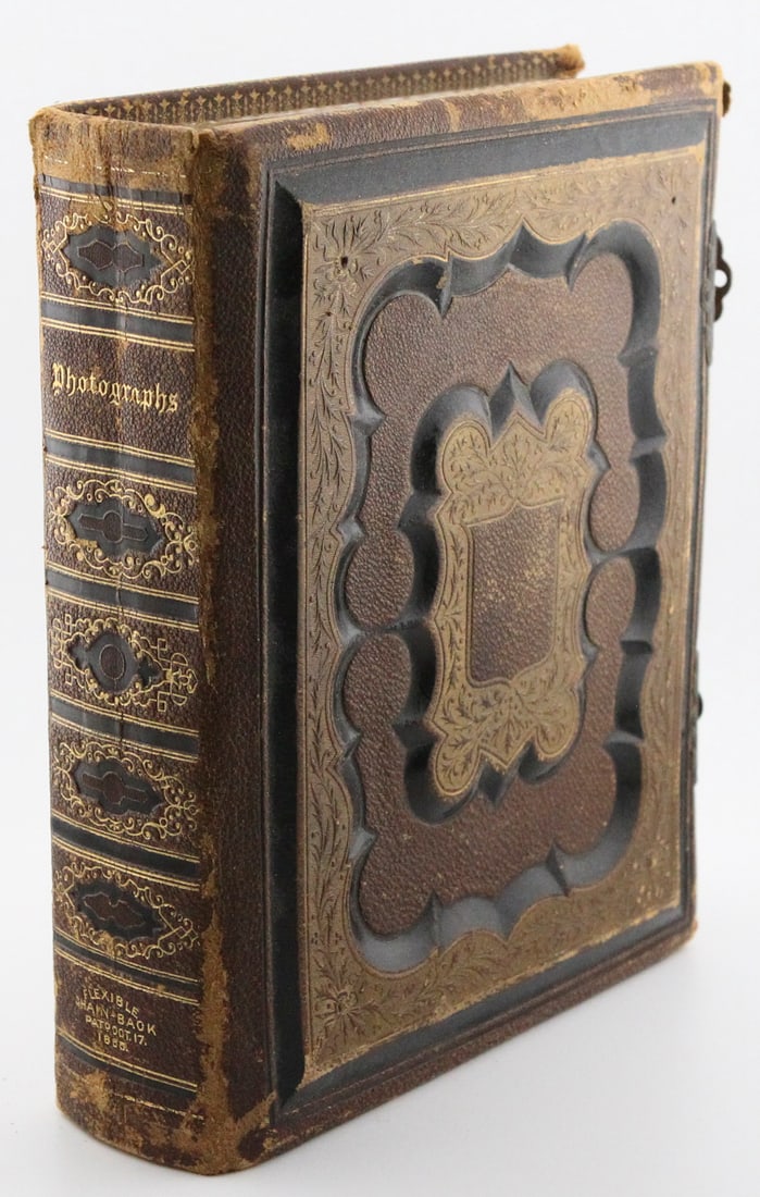 Antique Leatherbound with Locks Photograph Album: Antique Leatherbound with Locks Photograph Album Size: H9 x W7 x D2.5 in. Leather, cardstock, and metal. Wt: 2.5 lbs. This Antique Leatherbound Photograph Album, dating back to 1865, is a treasure of 
