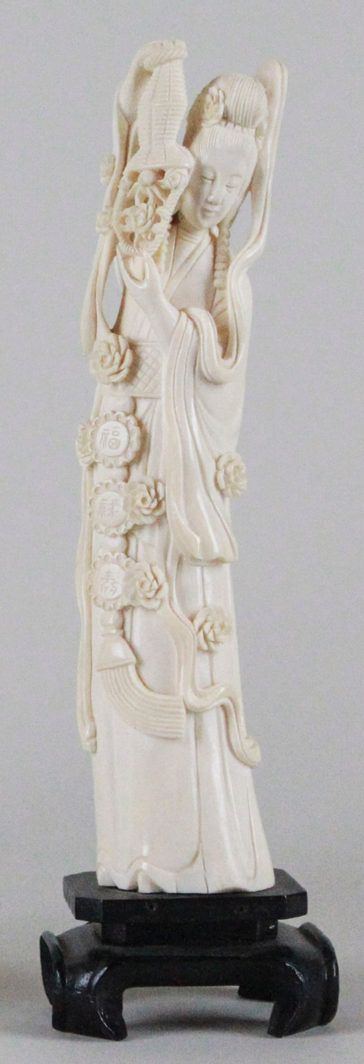 Antique Ox Bone Carving of Guanyin Figure: This exquisite antique ox bone carving represents the revered figure of Guanyin, the Goddess of Mercy, standing gracefully at 11 inches tall. Delicately crafted, the figure features intricate details,