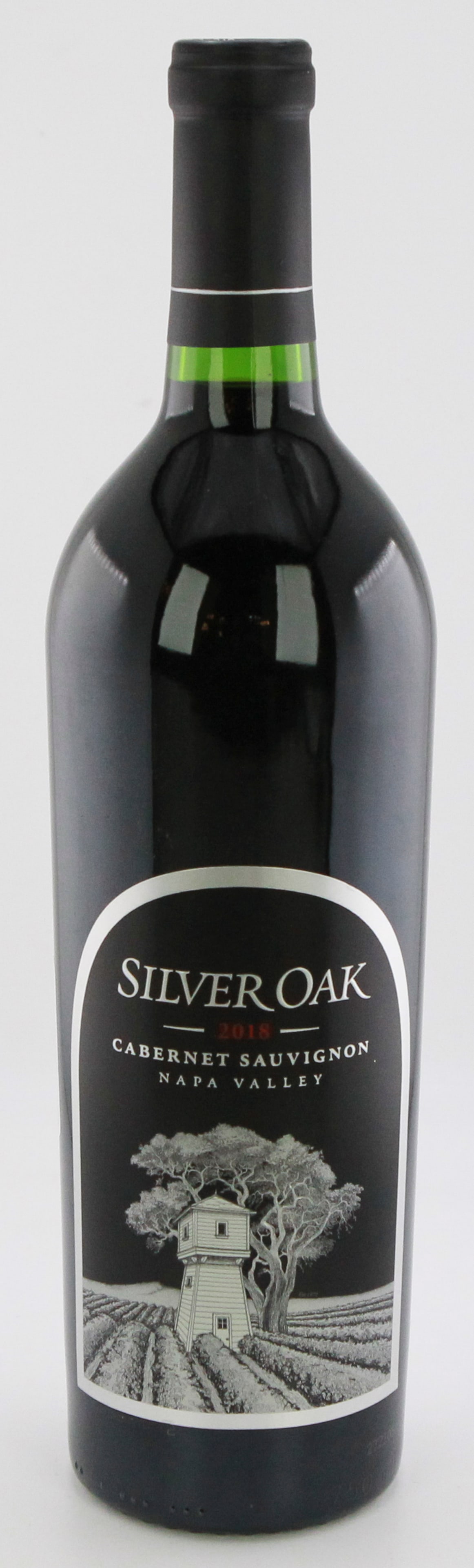 Silver Oak 2018 Cabernet Sauvignon Napa Valley: A bottle of Silver Oak 2018 Cabernet Sauvignon from Napa Valley. A renowned wine known for its deep blackberry and cassis flavors, complemented by elegant oak aging. Stored in a climate-controlled ref