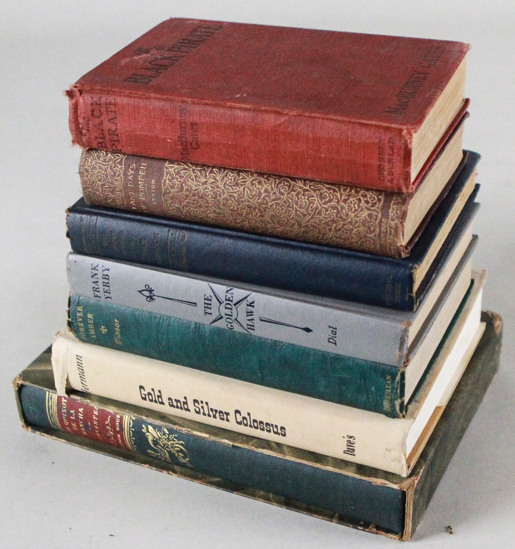 Lot of 7 Vintage Books including The Golden Hawk and Black Pirate: This lot includes seven vintage books, featuring The Golden Hawk by Frank Yerby, Black Pirate, and Gold and Silver Colossus. A great selection for collectors of historical and adventure literature. Pl