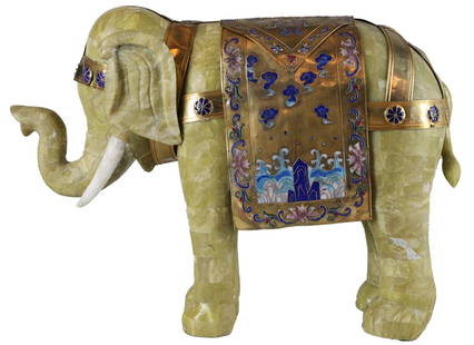 Large Chinese Motif Soapstone Elephant Statue: Impressive large Chinese motif elephant statue, carved from natural soapstone and adorned with decorative enamel and metal saddle accents. Measuring 20 inches high by 27 inches wide and 9 inches deep,
