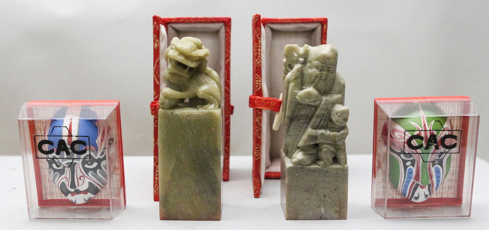 Lot of 4 Vintage Chinese Memorabilia: This collectible lot features two carved soapstone stamp seals inscribed with the names "Anne" and "Anna," each showcasing intricate craftsmanship and presented in their original decorative boxes, alo
