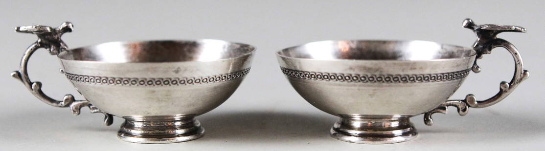 Pair of Antique Sterling Silver Armenian Mini Cups: This exquisite pair of antique sterling silver mini cups features elegant dove motifs perched on the curved handles, showcasing the artistry of Armenian silversmiths. Decorated with a delicate ornamen