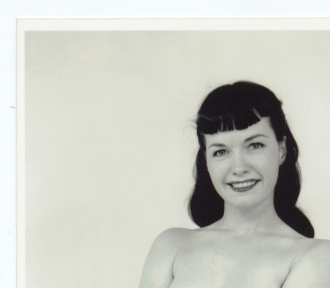 Irving Klaw Bettie Page Photograph / 5 of 10 Limited Edition: This limited edition Bettie Page photograph, captured by the infamous Irving Klaw, is a true collector’s item. Measuring 4x6 inches, this black-and-white image was printed from the original negative