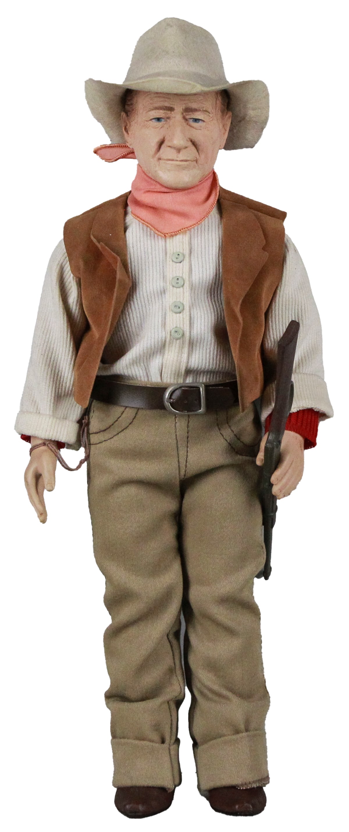 1981 Effanbee John Wayne Collector Doll – 17" Western Outfit with Rifle: This 17-inch John Wayne collector doll by Effanbee, released in 1981, pays tribute to the legendary Western film icon. Dressed in classic cowboy attire, the doll features a felt hat, red bandana, faux