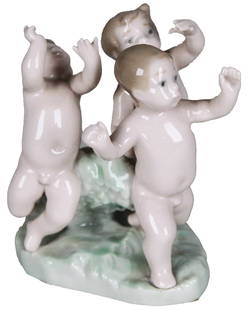 Lladro Porcelain Figurine “Three Dancing Cherubs” #5806, Spain: This charming Lladro porcelain figurine titled “Three Dancing Cherubs” (model #5806) captures the joy and innocence of childhood with three nude cherubic children in a playful dance, their