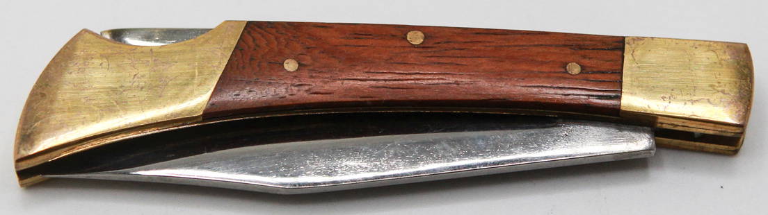 Vintage Folding Pocket Knife with Brass Bolsters and Wood Handle: his classic 6.75-inch folding pocket knife features a 3-inch stainless steel blade and a handsome wooden handle framed by brass bolsters. The blade, marked "Stainless China," folds smoothly into the h