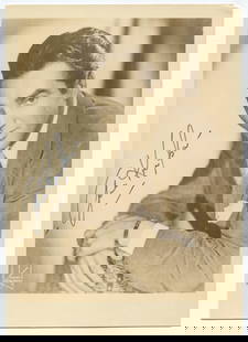 Gene Krupa Signed Vintage Photo Postcard (7" x 5"): This elegant 7 x 5 inch sepia-toned photo postcard is hand-signed by iconic jazz drummer and bandleader Gene Krupa in blue ink. Known for revolutionizing the role of the drummer in big band music, Kru