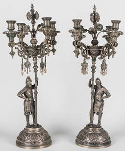 Pair of Russian Silver Figural Candelabra by Sazikov, Early 1900s: An exceptional pair of antique Russian sterling silver candelabra by renowned Imperial Court silversmith Sazikov, dating to the early 1900s. Each candelabrum stands 22 inches tall and 9.5 inches