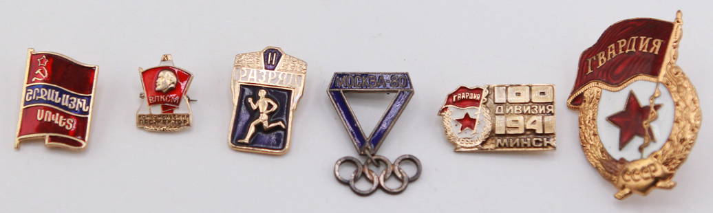 Collection of 6 Vintage Soviet Union Pins: Assortment of six vintage Soviet-era pins, including a Georgian SSR flag pin, Lenin youth badge (VLKSM), athletic sports rank pin, Moscow 1980 Olympics triangle badge with Olympic rings,
