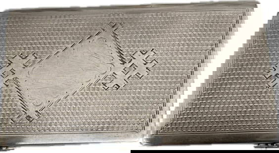Antique Russian Sterling Silver Cigarette Case by Kosima Volkov, 1898 Kiev: This exquisite antique Russian sterling silver cigarette case, crafted by Kosima Volkov in 1898 in Kiev, features a finely engine-turned surface with an ornate central motif, displaying a rich texture