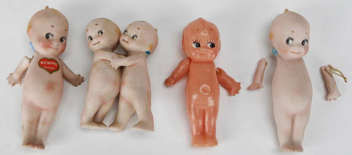 Lot of 4 Small Kewpie Dolls – Mixed Materials with Germany Mark: This lot includes four charming small Kewpie dolls, with the largest measuring approximately 4.5 x 2.25 x 1.75 inches. The group consists of three bisque porcelain dolls—one marked “Kewpie Germany