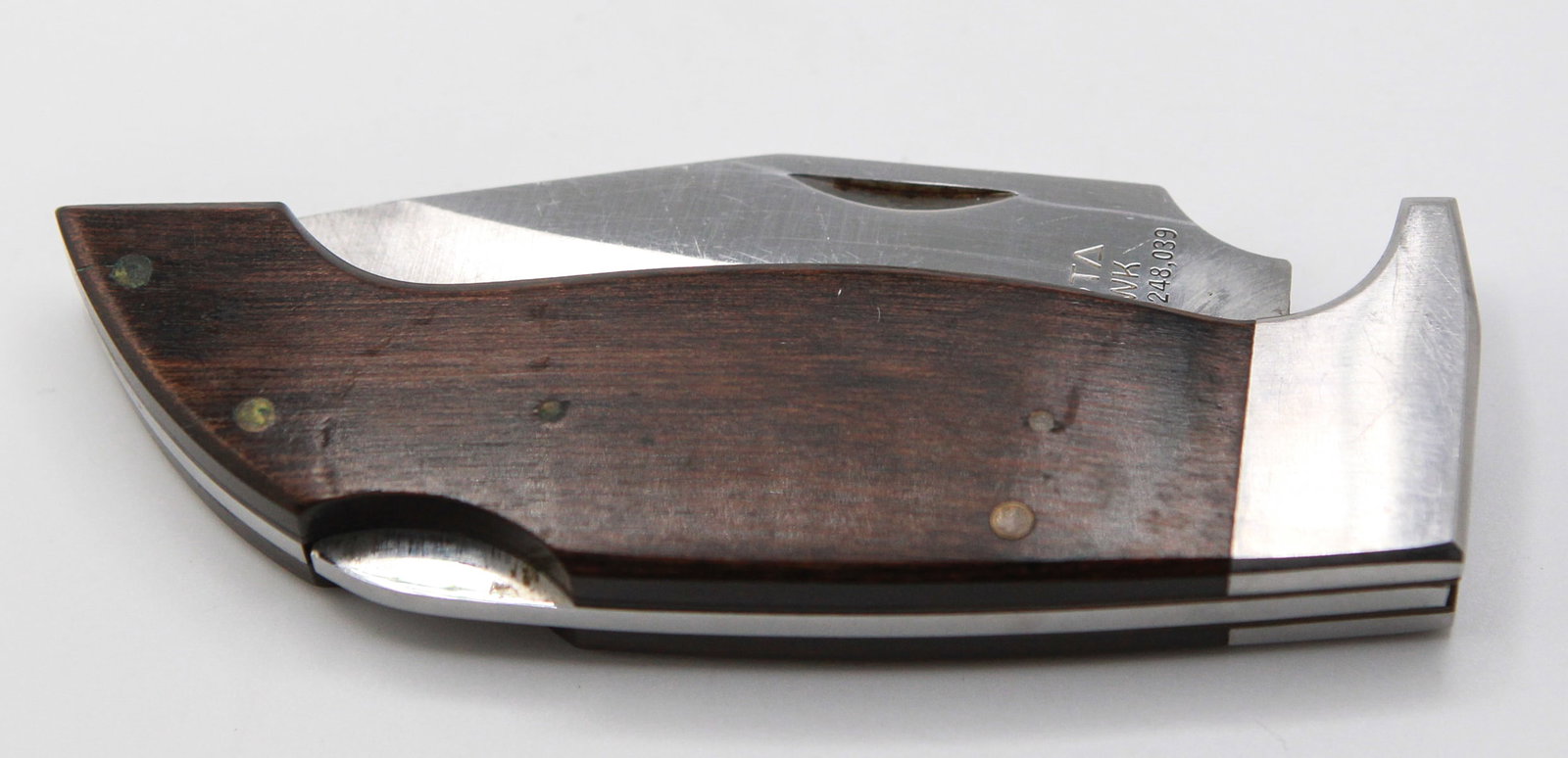Lakota Lil' Hawk Folding Knife by S. Sakurai, Seki Japan: This Lakota Lil’ Hawk folding knife is a rare and collectible piece, designed by S. Sakurai and crafted in Seki, Japan. The knife features a distinctive satin-finished stainless steel blade etched w