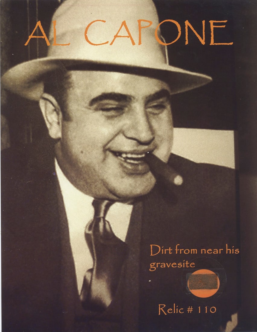 Al Capone Gravesite Dirt Relic Card with Certificate: This intriguing relic (Relic #110) contains authenticated dirt from near the gravesite of infamous mobster Al Capone. Displayed on a bold 8.5" x 11" card and accompanied by a certificate of authentici