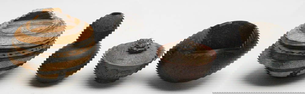 4 Pieces of Vintage Wooden African Containers: This unique set features four intricately carved vintage wooden African containers, each with distinct shapes and decorative patterns. Included are a lidded tribal storage bowl, a double-gourd