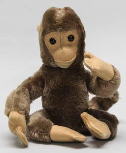 Vintage Plush Monkey with Bendable Limbs – 7": Charming vintage plush monkey figure, measuring approximately 7 inches tall, crafted from soft brown synthetic fur with tan felt hands, feet, ears, and face. This playful toy features internal