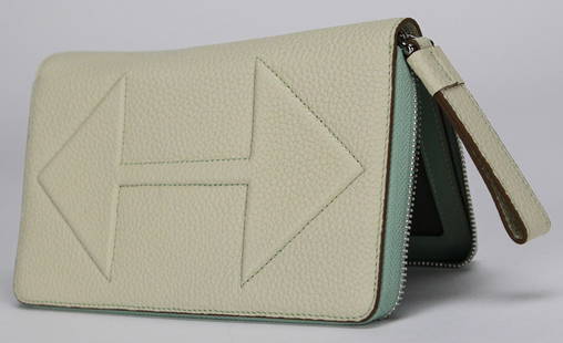 Urbano Cardinale Italian Calf Leather Zip-Around Wallet in Cream & Mint: Crafted in Italy from premium calf leather, this Urbano Cardinale zip-around wallet blends refined style with exceptional functionality. The exterior features a soft pebbled cream leather accented