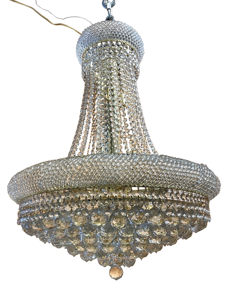 French Empire Style Crystal Basket Chandelier: Elegant French Empire style crystal basket chandelier featuring a gilt metal frame lavishly adorned with faceted crystal beads and cascading crystal strands forming a graceful trumpet silhouette