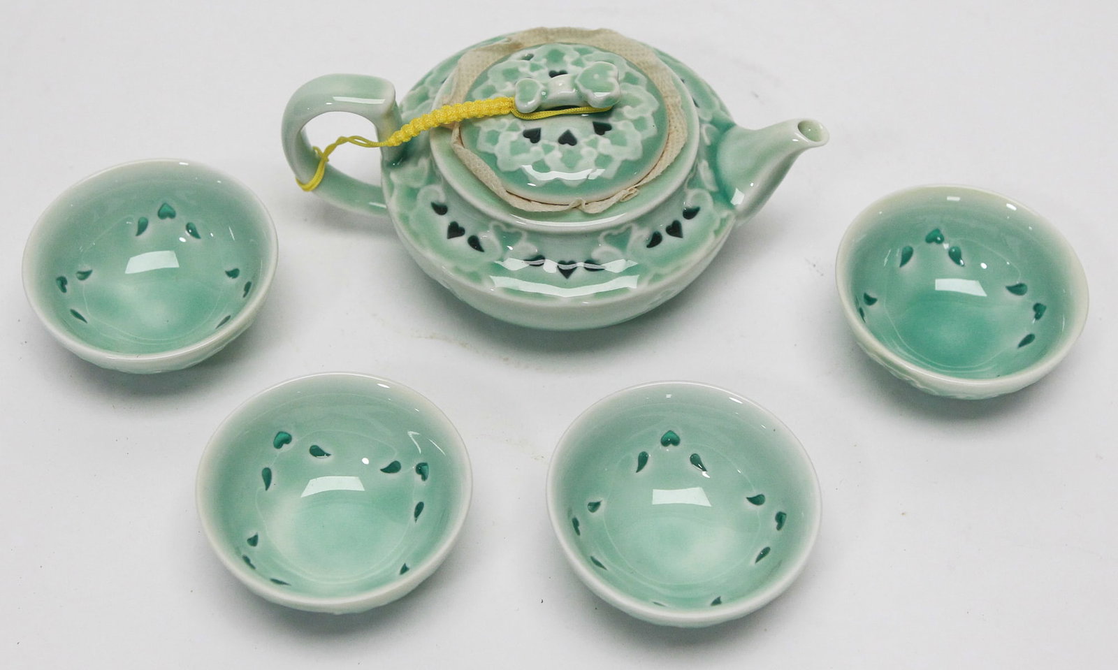 Chinese Celadon Glazed Porcelain Tea Set with Pierced Teapot & Four Cups (1 of 2)