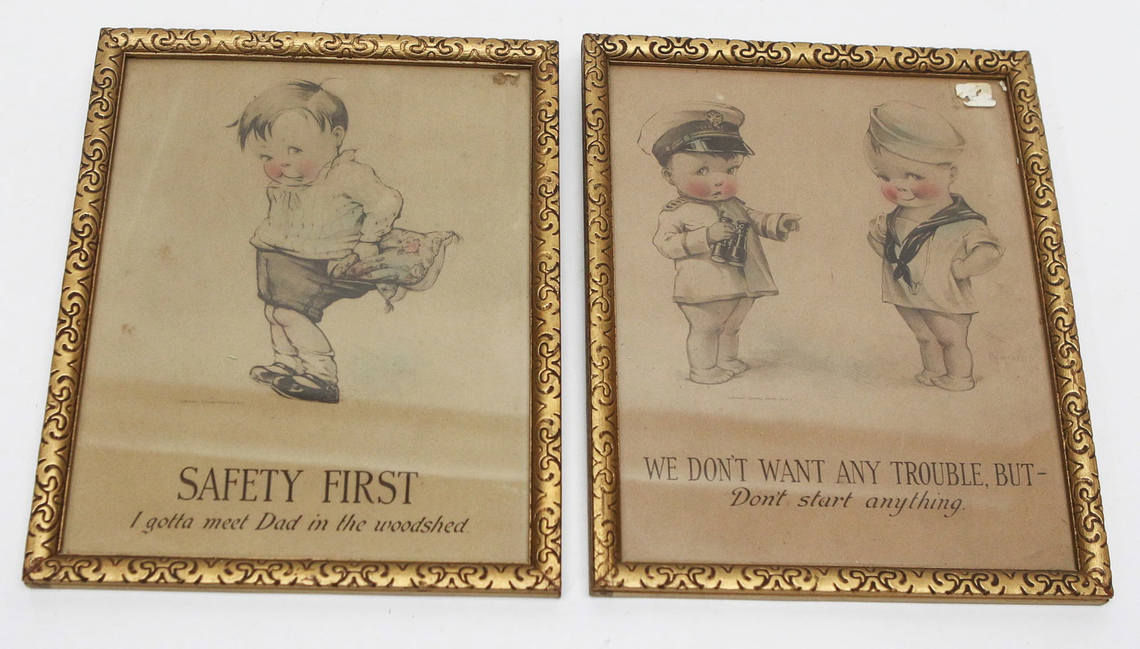Pair of Vintage Framed Child Motto Prints: Pair of vintage framed child-themed motto prints featuring charming illustrations of rosy-cheeked children with humorous captions, including "Safety First – I gotta meet Dad in the woodshed" and "We