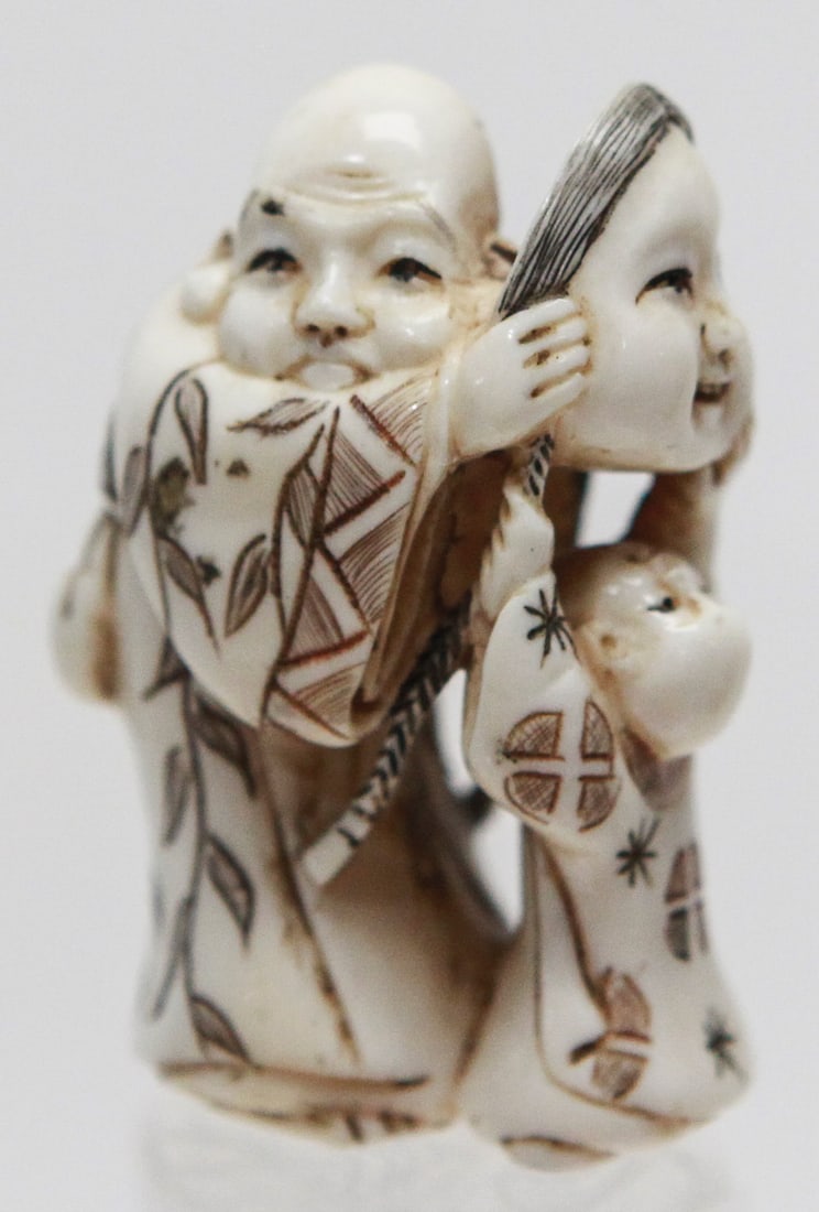 Vintage Japanese Netsuke of Man and Child Holding Noh Mask (1 of 6)