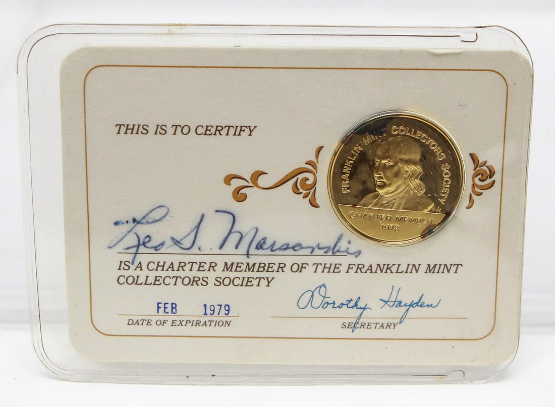 1978 Franklin Mint Collectors Society Charter Membership Card with 24KT Gold on Sterling Medal: 1978 Franklin Mint Collectors Society Charter Membership Card featuring a 24KT gold-on-sterling silver Benjamin Franklin medal mounted in the original plastic holder. The personalized membership card