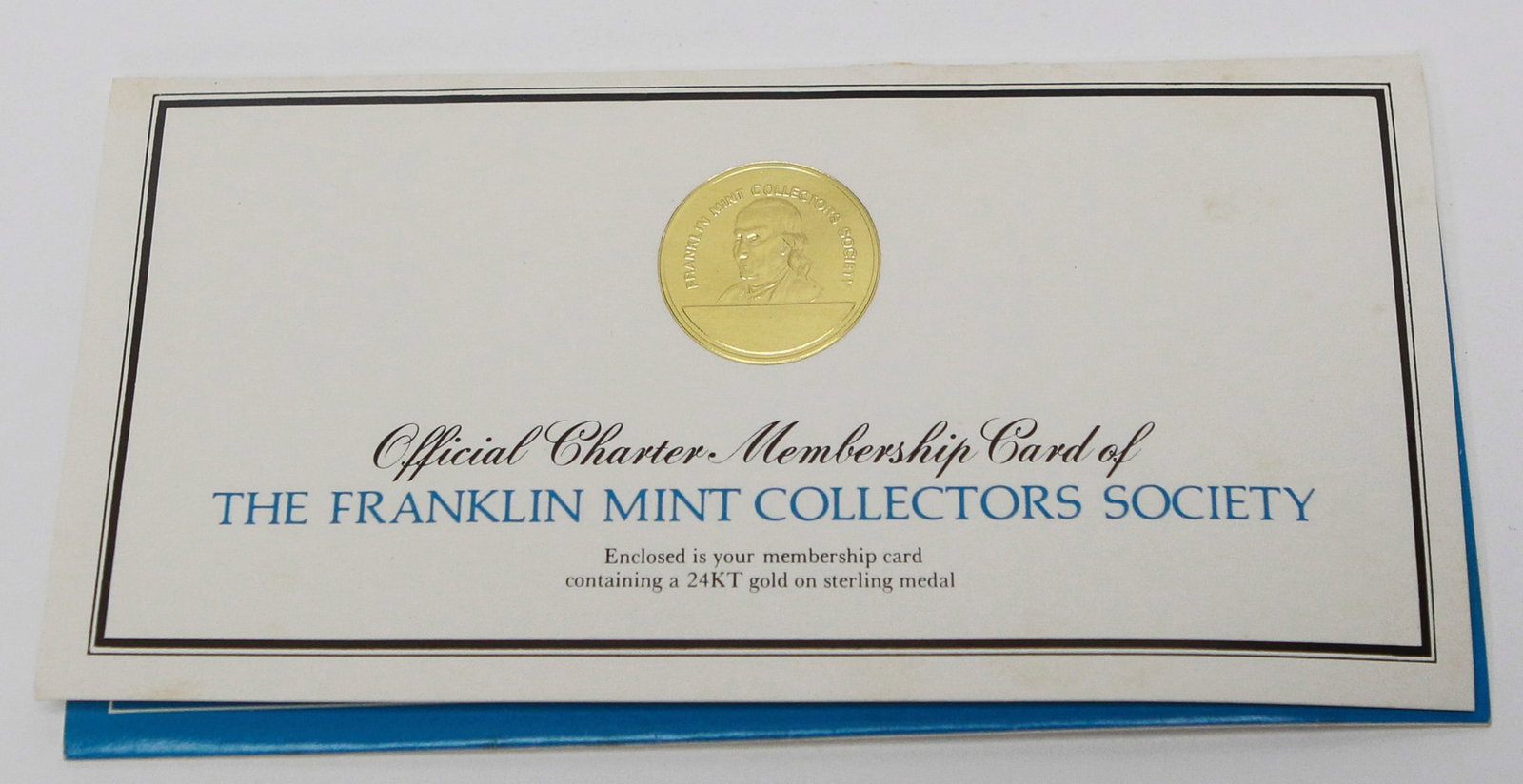 1975 Franklin Mint Collectors Society Charter Membership Card with 24KT Gold: Original 1975 Franklin Mint Collectors Society Official Charter Membership Card presentation featuring a 24KT gold on sterling silver Charter Member medal mounted in its original plastic holder and