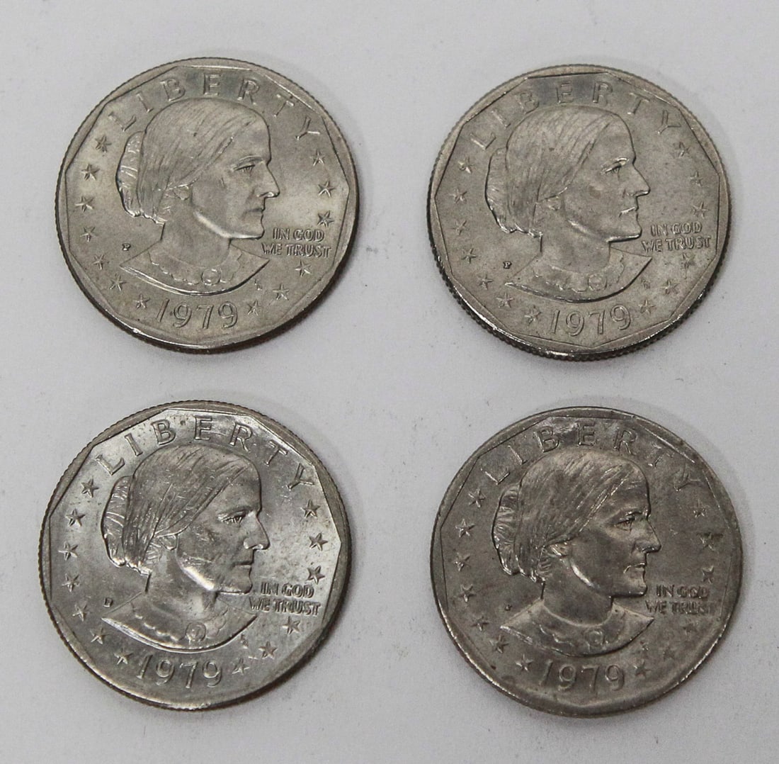 Lot of 4 Susan B. Anthony Dollar Coins (1979): Lot of four 1979 Susan B. Anthony U.S. dollar coins featuring a mix of Philadelphia (P) and Denver (D) mint marks. Coins are in circulated condition with light to moderate wear and surface marks from