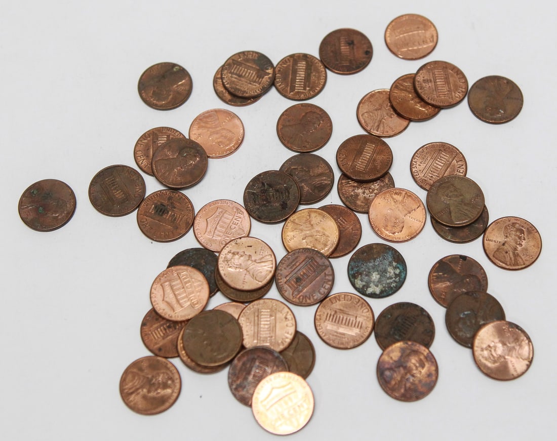 Lot of 52 Assorted Lincoln Memorial Cents: Lot of 52 U.S. Lincoln Memorial one-cent coins, consisting of mixed dates and mint marks spanning multiple decades. The group includes circulated examples with varying degrees of wear, toning,