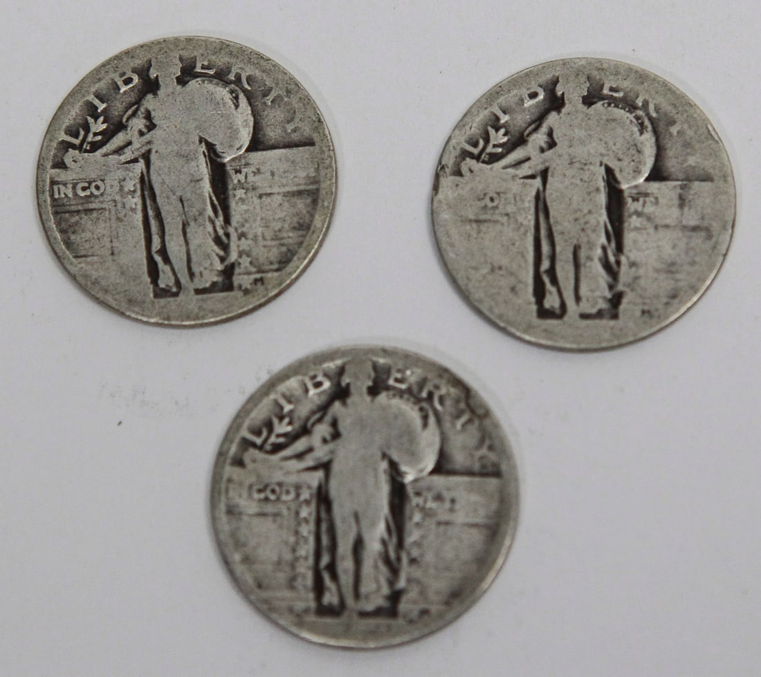 Lot of 3 United States Standing Liberty Silver Quarters: Lot of three United States Standing Liberty silver quarters featuring the classic Liberty design on the obverse. The coins are well circulated with moderate to heavy wear, resulting in partially worn 