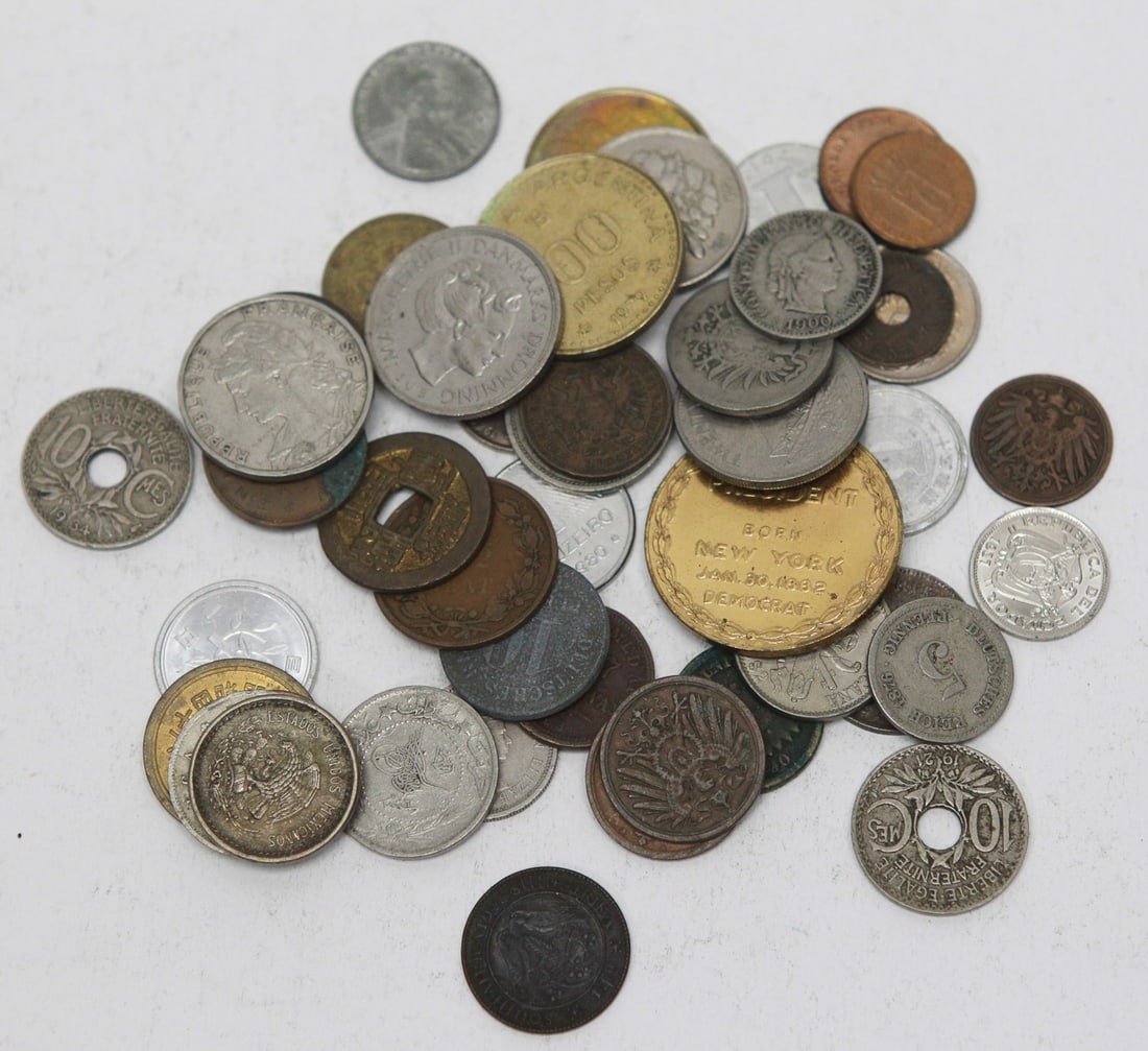 Lot of 50 Assorted World Coins, Foreign Currency, and Tokens: Lot of approximately 50 assorted world coins and tokens from a wide variety of countries and time periods. The group includes copper, bronze, brass, nickel, and aluminum coins from Europe, Asia, and