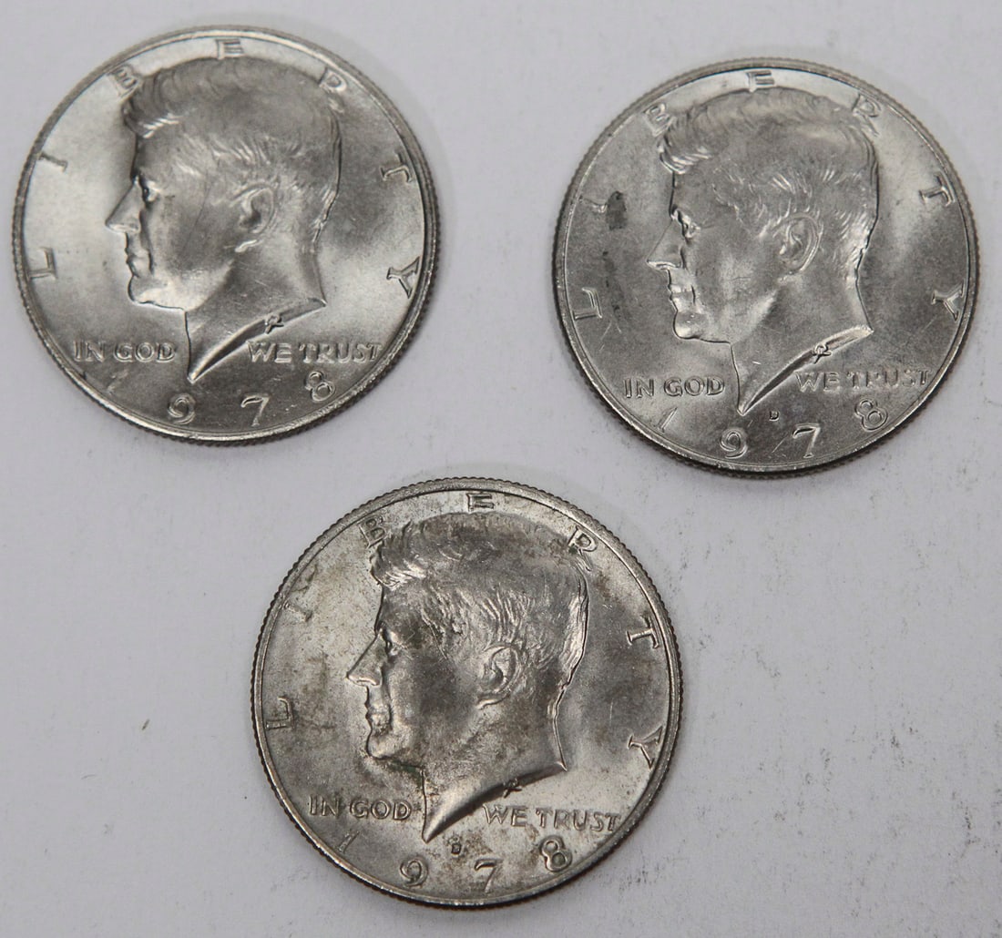 Lot of 3 Kennedy Half Dollars – 1978 U.S. Clad Half Dollar Coins: Lot of three (3) United States Kennedy Half Dollar coins dated 1978. Each coin features President John F. Kennedy on the obverse and the Presidential Seal on the reverse. Struck in copper-nickel clad