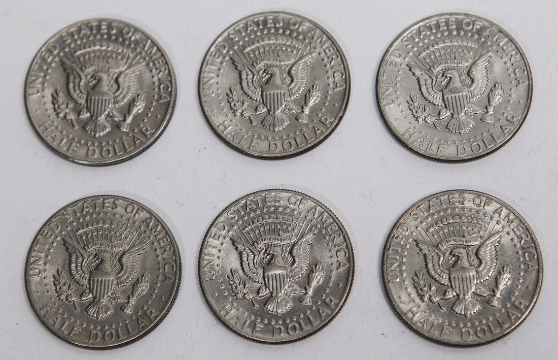 Lot of 6 1971 Kennedy Half Dollar Clad Coins: Collection of six 1971 United States Kennedy Half Dollar coins struck in copper-nickel clad composition. Each coin features the portrait of President John F. Kennedy on the obverse and the