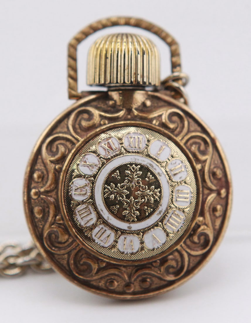 Vintage Decorative Pocket Watch Style Pendant Necklace: Vintage pocket watch style pendant necklace featuring an ornate gold-tone case with decorative scrollwork, Roman numeral dial motif, and floral design on the reverse. The pendant measures approximatel