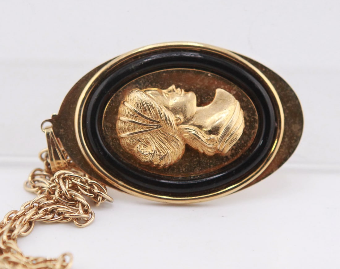 Vintage Gold-Tone Lady Cameo Style Pendant Necklace: Vintage gold-tone pendant necklace featuring a raised profile of a lady in classical cameo style set within a black oval surround. The pendant measures approximately 2.25 x 1.5 inches and is suspended