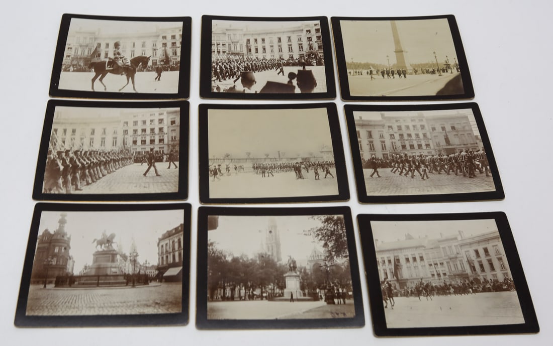 Lot of 9 Brussels Military Parade Photographs, c. 1919: Lot of nine antique gelatin silver photographs documenting a military parade and city views in Brussels, Belgium, around the end of World War I. The images depict a mounted officer, marching troops ca