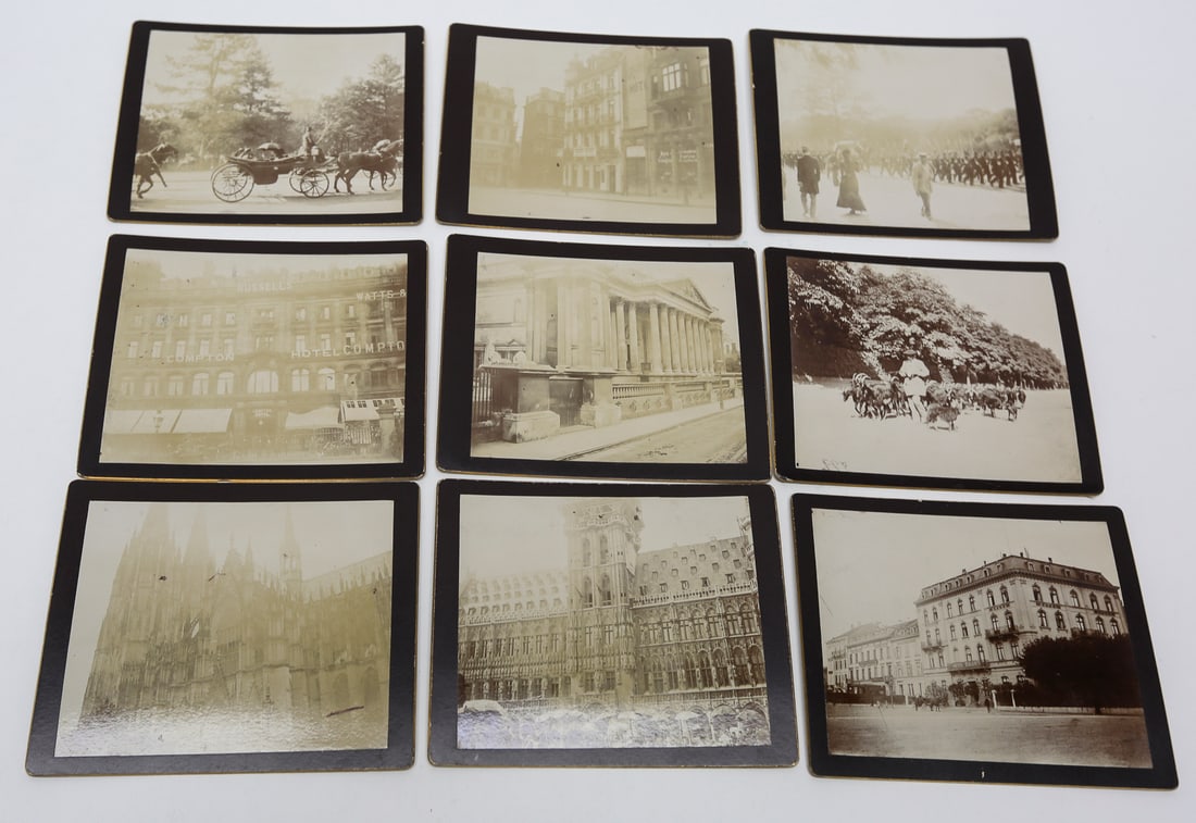 Lot of 9 European Travel and Military Photographs, c. 1919: Lot of nine antique gelatin silver photographs documenting European city views and public events following World War I. The images include horse-drawn carriages, marching troops, a military procession