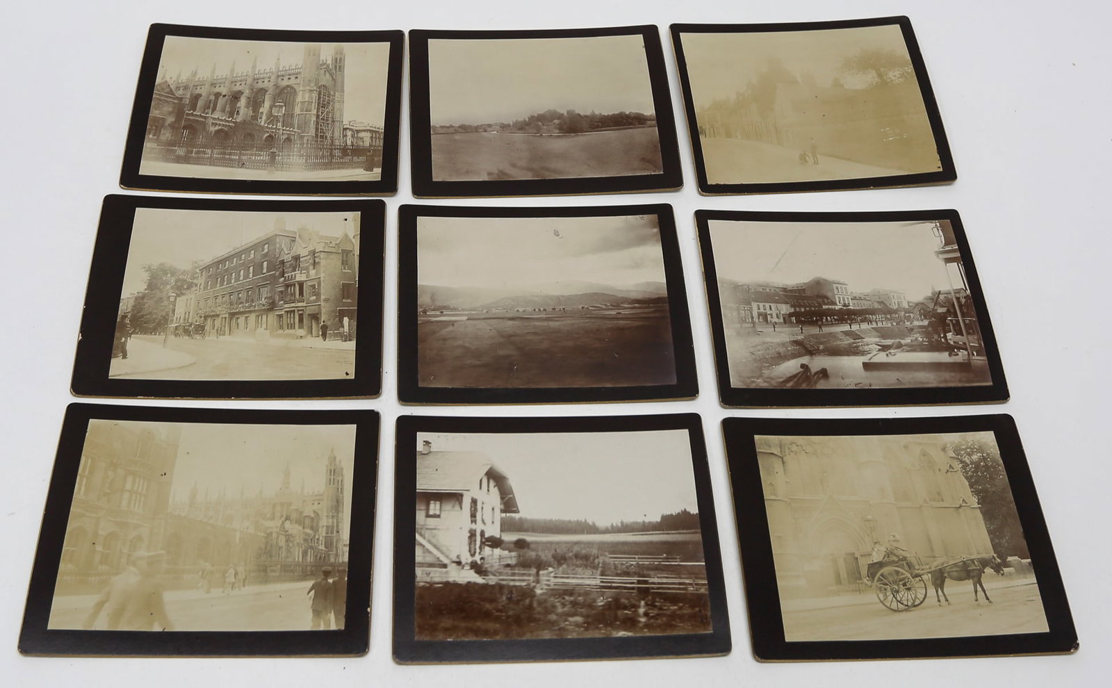 Lot of 9 Cambridge and European Travel Photographs, c. 1910s: Lot of nine antique gelatin silver photographs documenting Old Cambridge, England, and rural European travel. The images depict King’s College Chapel and other historic university architecture, city