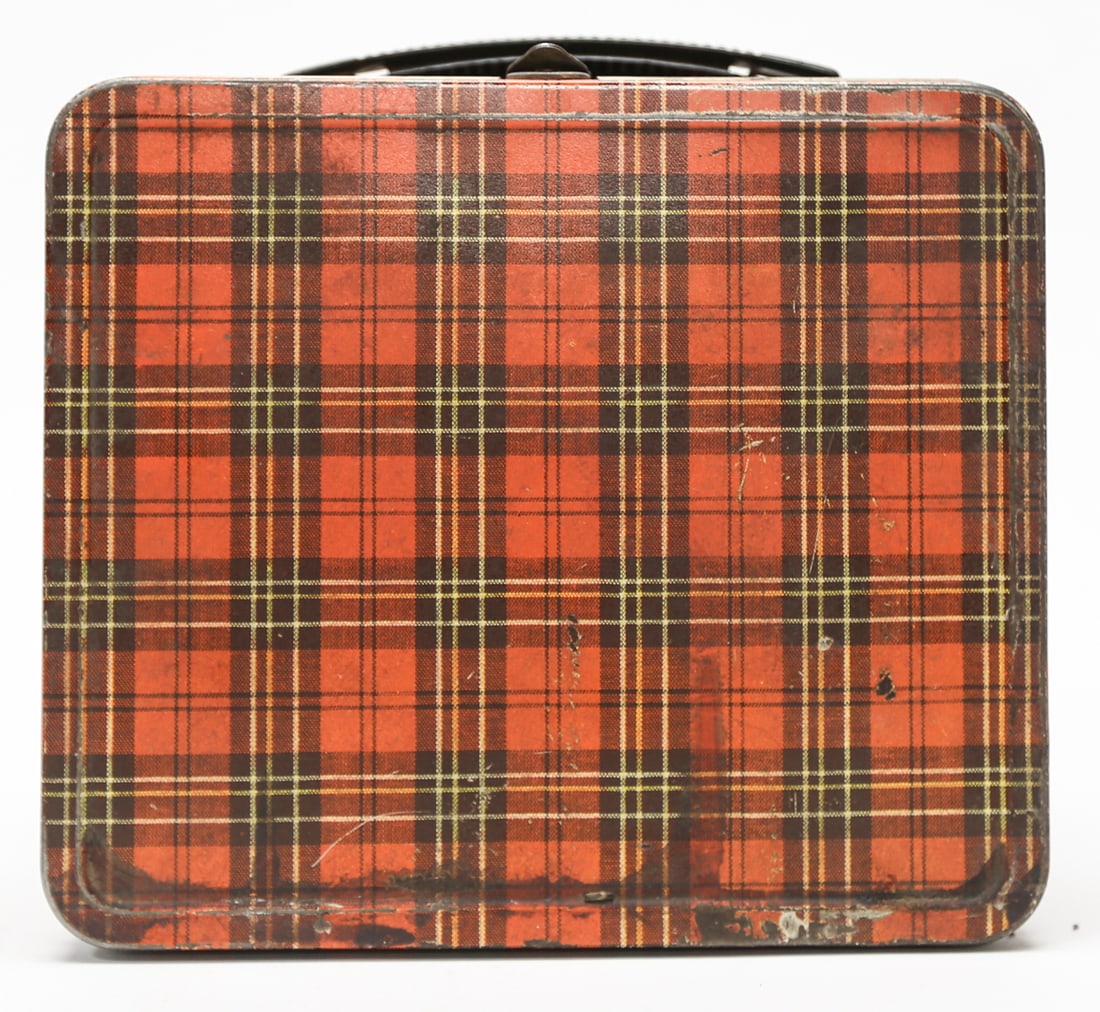 Vintage Red Tartan Plaid Metal Lunch Box: A vintage mid-century metal lunch box decorated throughout with a red, black, and yellow tartan plaid pattern. Measures approximately 7.5 x 8 inches and retains its black plastic carrying handle and m