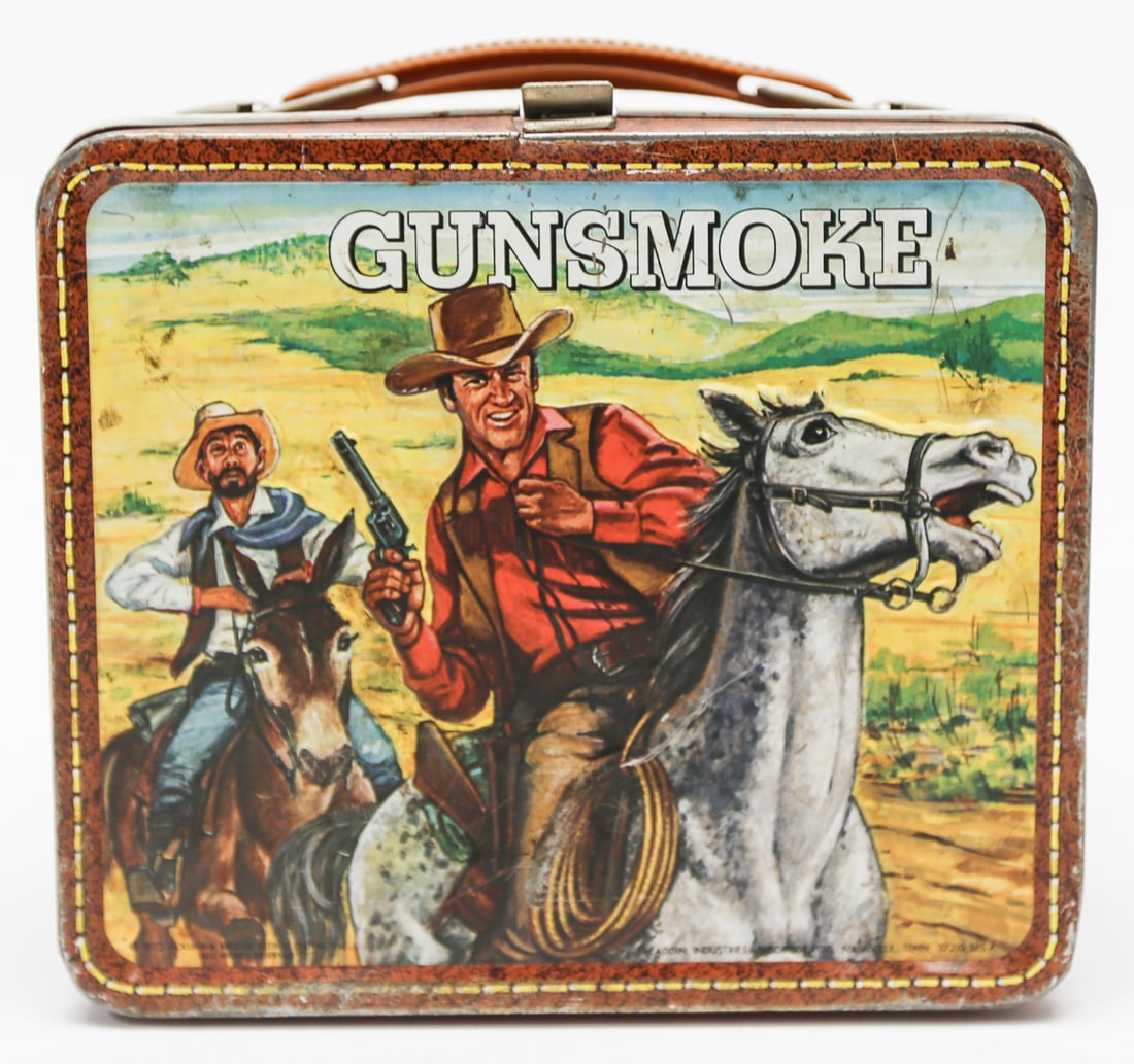 Vintage Gunsmoke Western Aladdin Metal Lunch Box: Vintage Gunsmoke metal lunch box by Aladdin Industries, featuring colorful Western scenes with cowboys, horses, and a stagecoach on both sides. Measures approximately 7 x 8 inches. Thermos is not incl