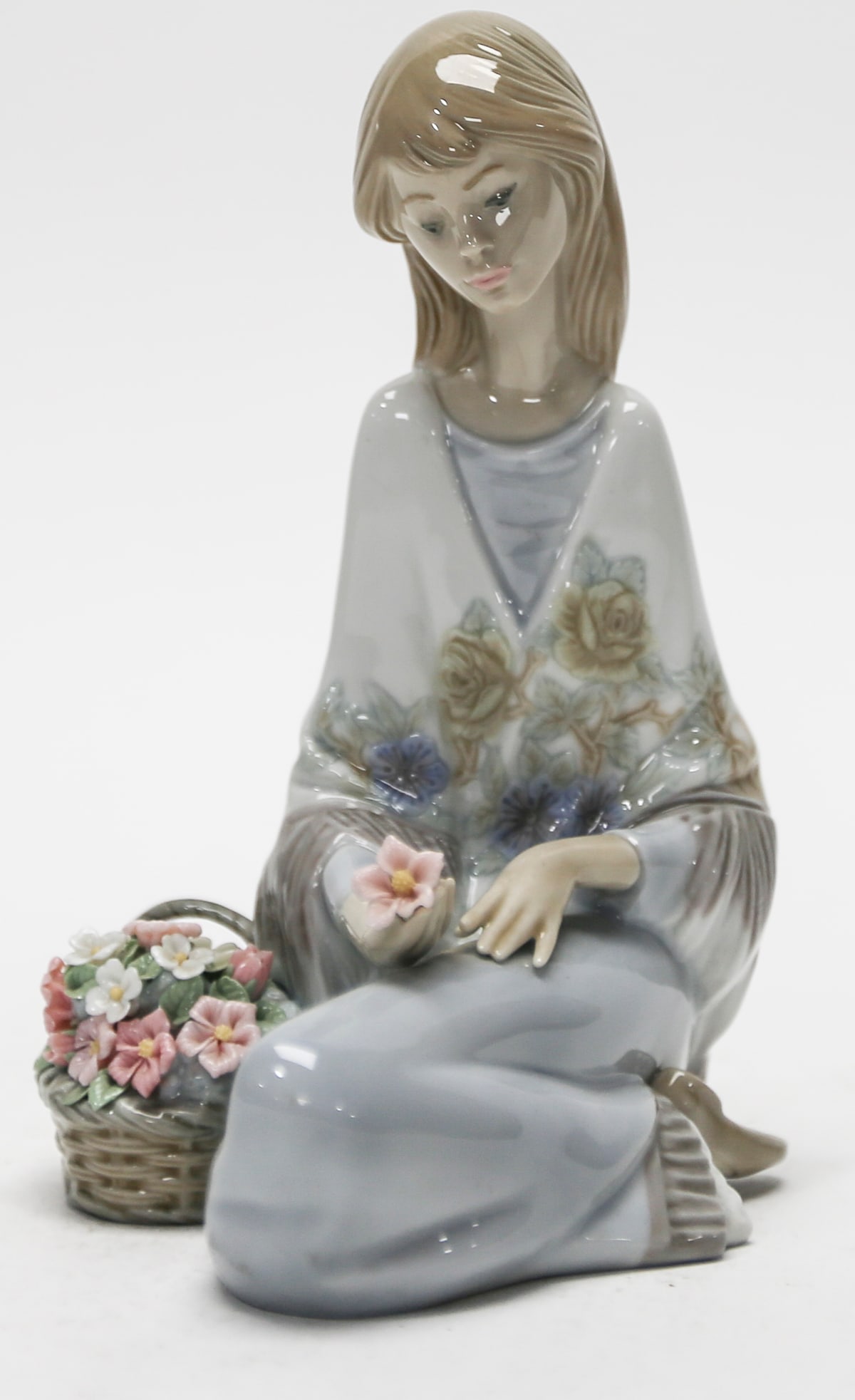 Lladro Flower Song Porcelain Figurine No. 7607: Retired Lladro glazed porcelain figurine titled Flower Song, model No. 7607, designed by Juan Huerta and issued in 1988 for the Lladro Museum Collectors Society. The composition depicts a graceful sea