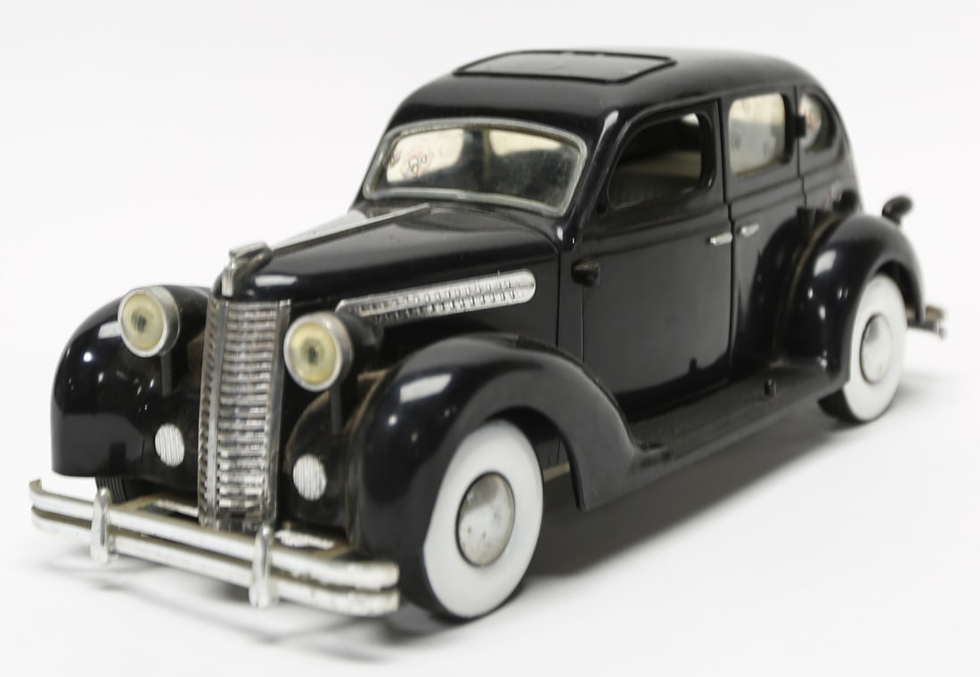 Disney Playmates Toys Vintage Black Model Car: Disney and Playmates Toys black plastic model automobile styled as a classic 1930s luxury sedan, featuring opening doors, a detailed interior, whitewall tires, chrome-tone trim, a roof panel, and a