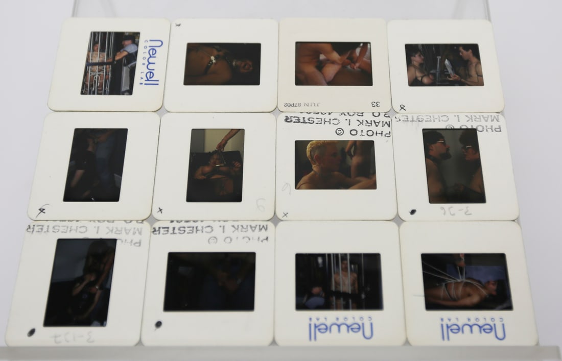 Mark I. Chester Male Erotic Color Slide Collection: Collection of 12 vintage color transparency slides featuring adult male erotic, bondage, and fetish-themed photography attributed to photographer Mark I. Chester. Several slides bear Newell Color Lab 