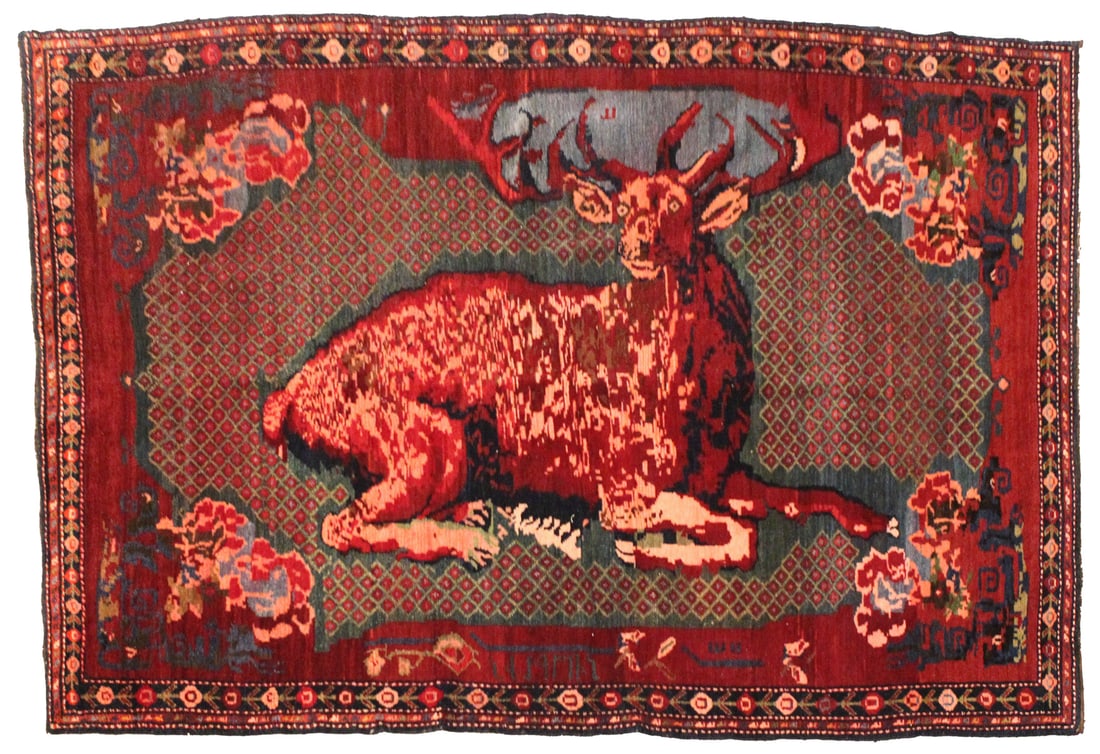 19th Century Armenian Karabagh Pictorial Rug: Antique 19th century Armenian Karabagh pictorial rug, handwoven in wool on wool, featuring a large recumbent stag surrounded by floral bouquets, geometric latticework, birds, human figures, Armenian i
